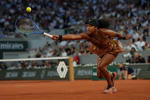 Japan's Naomi Osaka returns to Aryna Sabalenka of Belarus during the fourth-round tennis match at the French Open in Paris.