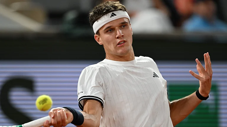 Czech Republic's Jakub Mensik returns to Brazil's Joao Fonseca during the quarterfinal tennis match at the French Open in Paris, Tuesday - AP