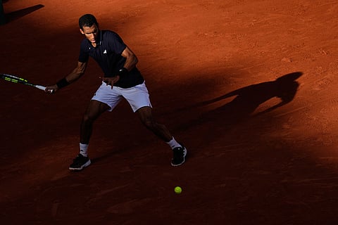 Canada's Felix Auger-Aliassime returns to Chile's Alejandro Tabilo during the fourth-round tennis match at the French Open in Paris.