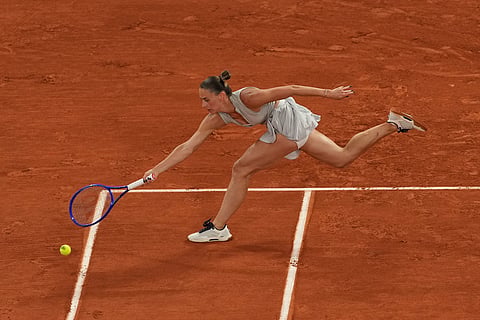 Ukraine's Marta Kostyuk reaches for the ball during the quarterfinal tennis match against Ukraine's Elina Svitolina at the French Open in Paris.
