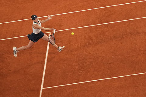 Ukraine's Elina Svitolina returns to Ukraine's Marta Kostyuk during the quarterfinal tennis match at the French Open in Paris.