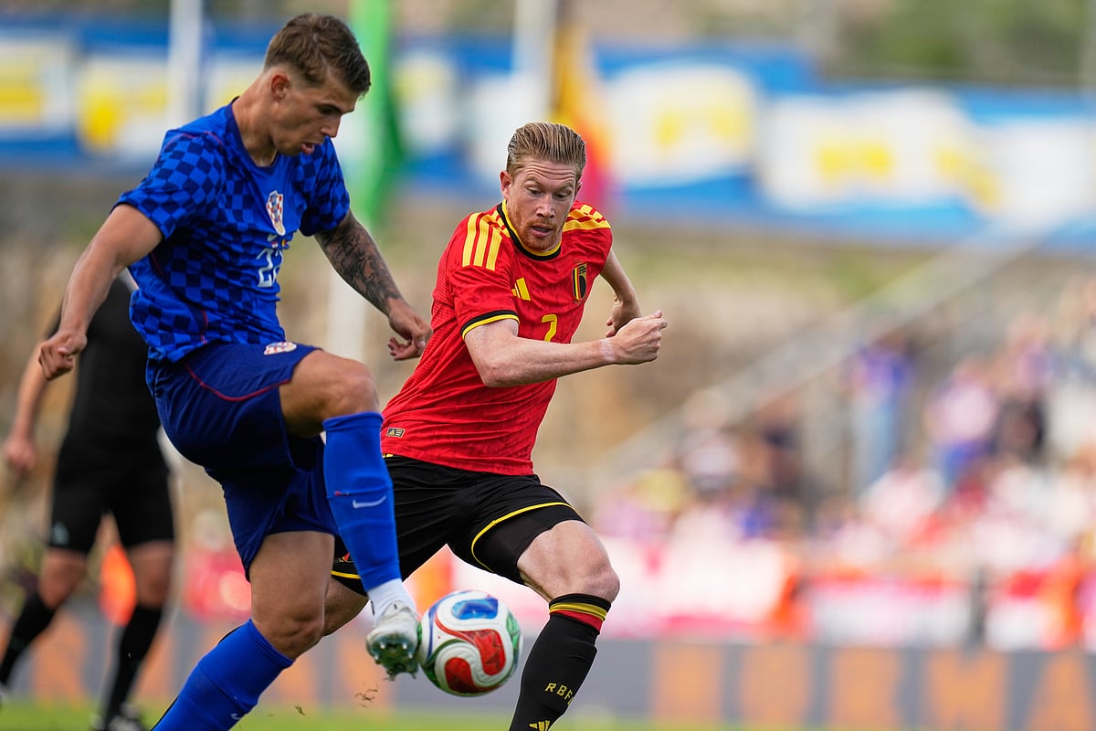 Luka Vuskovic, left, challenges for the ball with Belgium's Kevin De Bruyne during the international friendly soccer match between Croatia and Belgium in Rijeka - AP/Darko Bandic