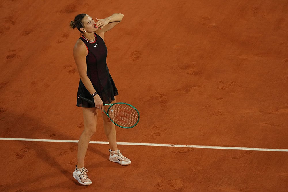 Aryna Sabalenka of Belarus reacts after winning the fourth-round tennis match against Japan's Naomi Osaka at the French Open in Paris. - | Photo: AP/Aurelien Morissard
