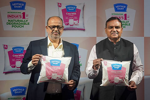 National Dairy Development Board (NDDB) Chairman and Managing Director (CMD) Meenesh Shah and Mother Dairy Fruit & Vegetable Pvt. Ltd. Deputy Managing Director Jayatheertha Chary during the launch of India's first naturally degradable milk pouch in soil, in New Delhi.