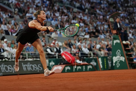 Aryna Sabalenka of Belarus returns to Japan's Naomi Osaka during the fourth-round tennis match at the French Open in Paris.