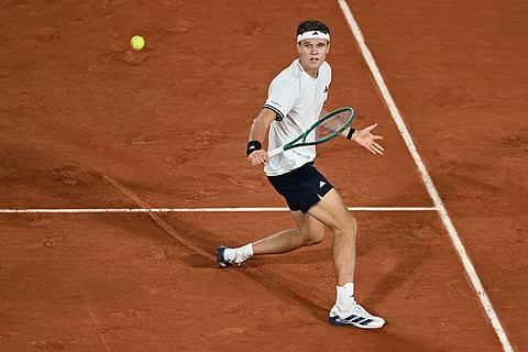 Czech Republic's Jakub Mensik returns to Brazil's Joao Fonseca during the quarterfinal tennis match at the French Open in Paris.