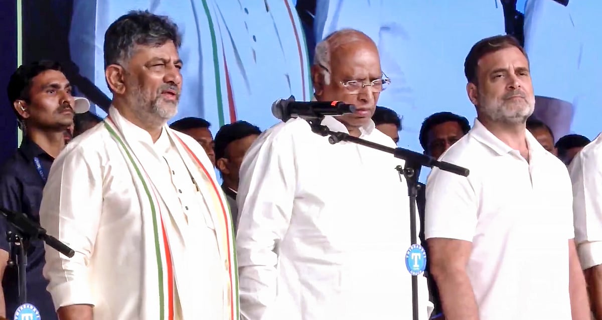 In this screengrab from a video posted on June 3, 2026, Lok Sabha LoP Rahul Gandhi with Congress President Mallikarjun Kharge and Karnataka Chief Minister-designate DK Shivakumar during the swearing-in ceremony of the new state government, in Bengaluru. - PTI