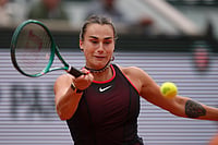 AP/Aurelien Morissard : Aryna Sabalenka of Belarus retruns to Russia's Diana Shnaider during the quarterfinal tennis match at the French Open in Paris, Wednesday.