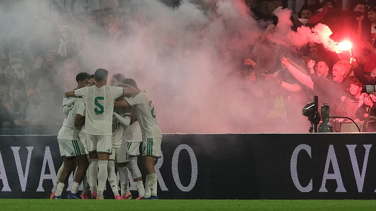 Algeria players celebrate after Algeria's Anis Hadj Moussa scored his side's opening goal during the international friendly soccer match between Netherlands and Algeria in Rotterdam, Netherlands. - AP Photo