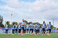 vPhoto: AP/Rebecca Blackwell : England players jog during a training session for the national soccer team in Palm Beach Gardens, Fla., ahead of the World Cup soccer tournament.