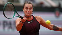 AP/Aurelien Morissard : Aryna Sabalenka of Belarus retruns to Russia's Diana Shnaider during the quarterfinal tennis match at the French Open in Paris, Wednesday.