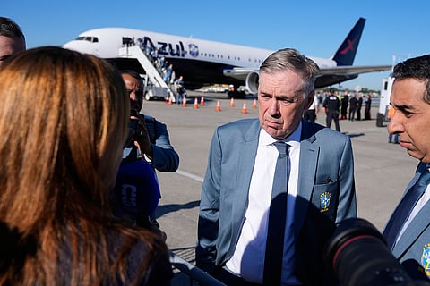 Brazilian national soccer team coach Carlo Ancelotti talks to reporters as the team arrives at Newark Liberty International Airport in Newark, N.J., Tuesday, June 2, 2026, as the team arrives ahead of the World Cup soccer tournament.