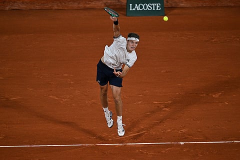 Czech Republic's Jakub Mensik returns to Brazil's Joao Fonseca during the quarterfinal tennis match at the French Open in Paris.