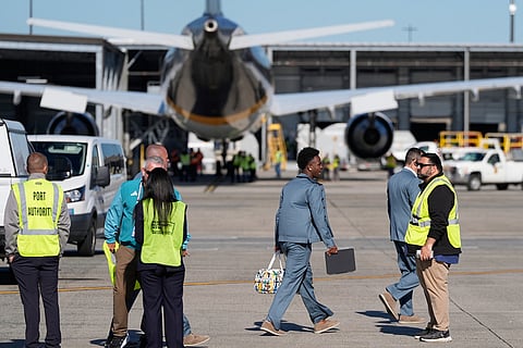Brazilian soccer player Vinícius Júnior, center right, boards the team bus after disembarking at Newark Liberty International Airport in Newark, N.J., as the team arrives ahead of the World Cup soccer tournament.