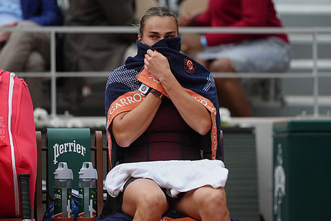 Aryna Sabalenka of Belarus takes break between the games during the quarterfinal tennis match against Russia's Diana Shnaider at the French Open in Paris.