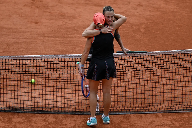 Aryna Sabalenka of Belarus hugs Russia's Diana Shnaider after the quarterfinal tennis match at the French Open in Paris, Wednesday, June 3, 2026. - AP