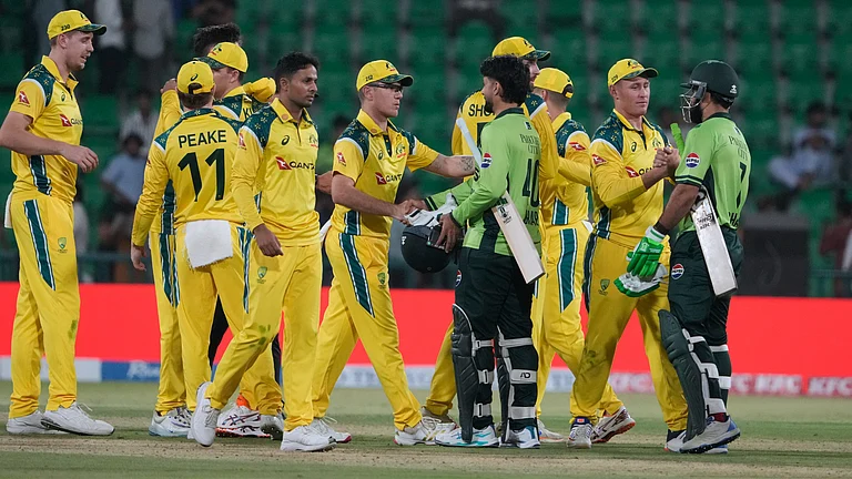 Pakistan's Shadab Khan, right and Abrar Ahmed, third right, shakes hand with Australian players on the end of second one-day international cricket match between Pakistan and Australia, in Lahore, Pakistan, Tuesday, June 2, 2026 - (AP Photo/K.M. Chaudary)