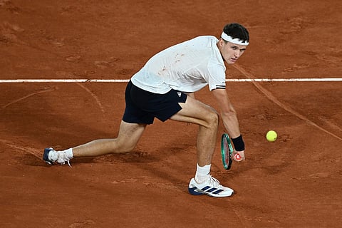 Czech Republic's Jakub Mensik returns to Brazil's Joao Fonseca during the quarterfinal tennis match at the French Open in Paris.