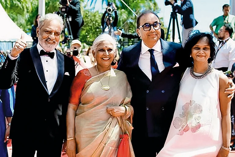 Showcasing A Classic (Left to Right) Actor Joy Mathew, editor Bina Paul and Film Heritage Foundation director Shivendra Singh Dungarpur at the Cannes Film Festival - | Courtesy: IMDB