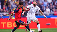 AP Photo : Spain's Ferran Torres, left, runs with the ball next to Iraq's Akam Hashim during an international friendly soccer match in A Coruna, Spain.