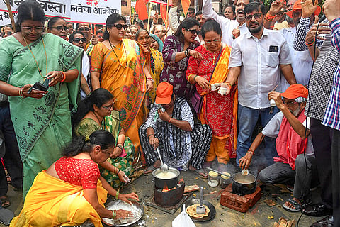 Shiv Sena (UBT) workers stage a protest against the union government over the price hike in petrol and LPG gas, in Mumbai.