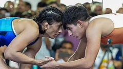 Vinesh Phogat, in blue, competes against Jyoti in a 53kg category wrestling match during the Asian Games selection trials, in New Delhi. - | Photo: PTI/Kamal Kishore