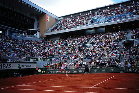 Russia's Mirra Andreeva returns to Ukraine's Marta Kostyuk during teh senifinal tennis tennis match at the French Open in Paris.