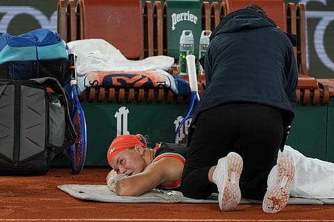 Russia's Diana Shnaider receives treatment during the semifinal tennis match against Poland's Maja Chwalinska at the French Open in Paris.