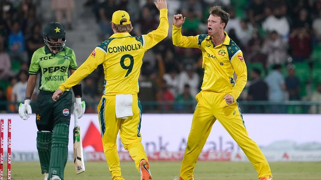 Australia's Matthew Kuhnemann, right, celebrates with Cooper Connolly after taking the wicket of Pakistan's Babar Azam, left, during the third one-day international cricket match between Pakistan and Australia, in Lahore, Pakistan, Thursday, June 4, 2026.  - AP Photo/K.M. Chaudary