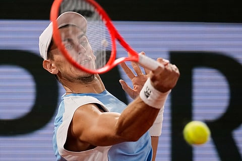 Italy's Matteo Arnaldi returns to Italy's Matteo Berrettini during the quarterfinal tennis match at the French Open in Paris.