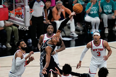 San Antonio Spurs forward Victor Wembanyama tries to shoot against the New York Knicks during the second half of Game 1 of the NBA Finals basketball series in San Antonio.