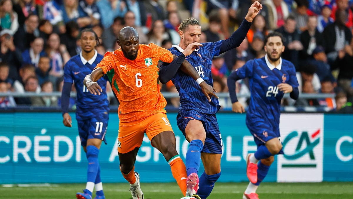 Ivory Coast's Seko Fofana, centre left, challenges for the ball with France's Adrien Rabiot during the international friendly soccer match between France and Ivory Coast in Nantes, France. - AP Photo
