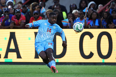 DR Congo's Noah Sadiki kicks the ball during the international friendly soccer match between DR Congo and Denmark in Liege, Belgium.
