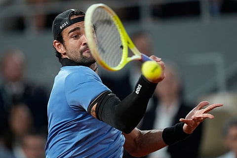 Italy's Matteo Berrettini returns to Italy's Matteo Arnaldi during the quarterfinal tennis match at the French Open in Paris.