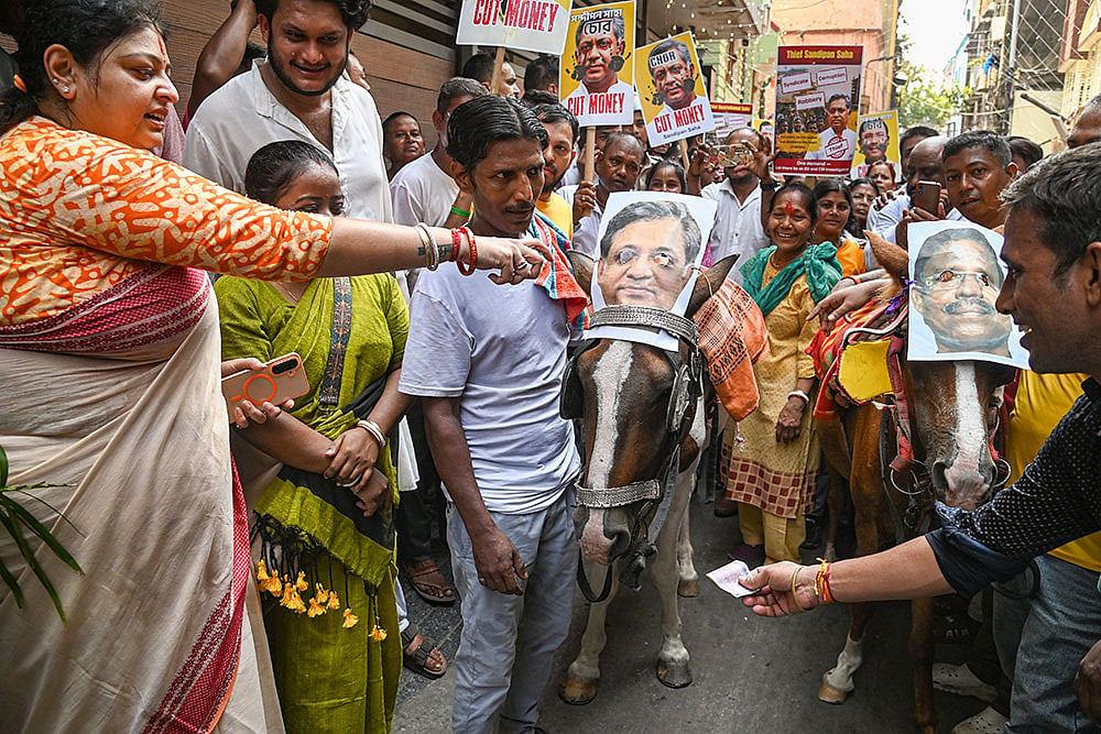BJP protest against rebel TMC MLA, father