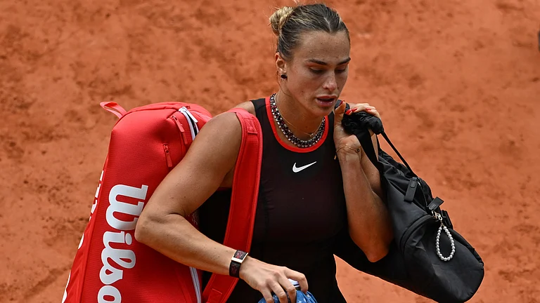 Aryna Sabalenka of Belarus walks off the court after the quarterfinal tennis match against Russia's Diana Shnaider at the French Open in Paris. - AP Photo