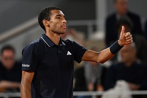 Canada's Felix Auger-Aliassime reacts during the quarterfinal tennis match against Italy's Flavio Cobolli at the French Open in Paris.
