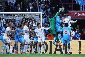 | Photo: AP/Omar Havana : DR Congo's Lionel Mpasi saves the ball during the international friendly soccer match between DR Congo and Denmark in Liege, Belgium.