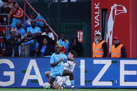 DR Congo's Yoane Wissa and Denmark's Joakim Mahle challenge for the ball during the international friendly soccer match between DR Congo and Denmark in Liege, Belgium.