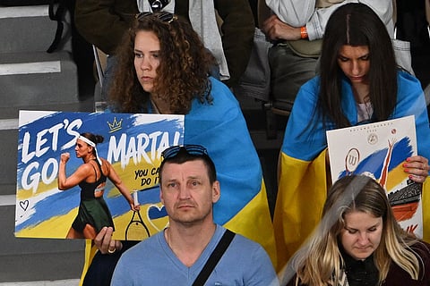 Fans supprt Ukraine's Marta Kostyuk during the semifinal tennis match against Russia's Mirra Andreeva at the French Open in Paris.
