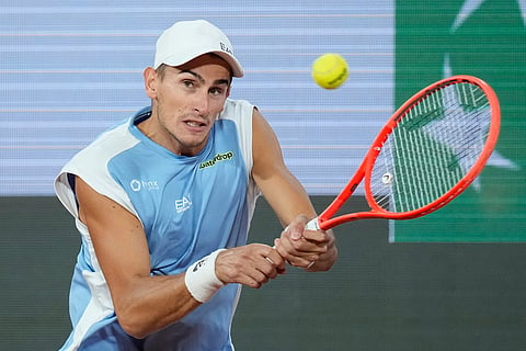 Italy's Matteo Arnaldi returns to Italy's Matteo Berrettini during the quarterfinal tennis match at the French Open in Paris.
