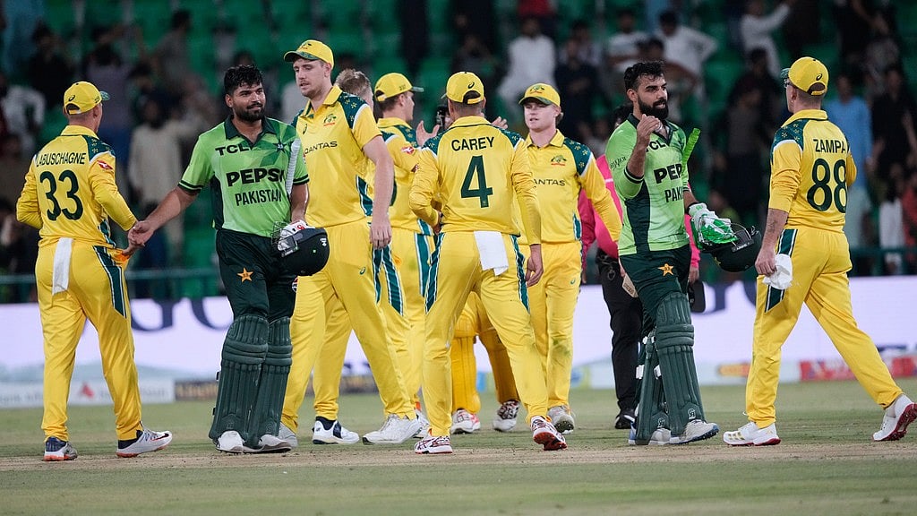 AP Photo/K.M. Chaudary : Pakistan's Shadab Khan, second right, and Abdul Samad, second left, shakes hand with Australian players on the end of the third one-day international cricket match between Pakistan and Australia, in Lahore, Pakistan, Thursday, June 4, 2026.