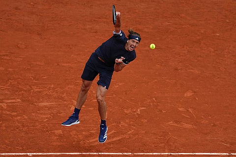 Germany's Alexander Zverev returns to Czech Republic's Jakub Mensik during the semifinal tennis match at the French Open in Paris.