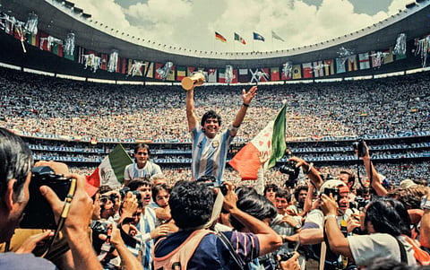 Diego Maradona with FIFA World Cup 1986 trophy clicked by David Yarrow.