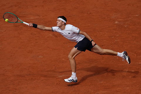Czech Republic's Jakub Mensik returns to Germany's Alexander Zverev during the semifinal tennis match at the French Open in Paris.