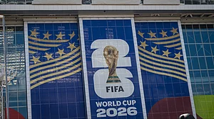 AP Photo : Signage on the exterior of AT&T Stadium, which will be named Dallas Stadium during the 2026 FIFA World Cup, is covered by workers as preparations continue at the venue ahead of the football tournament.