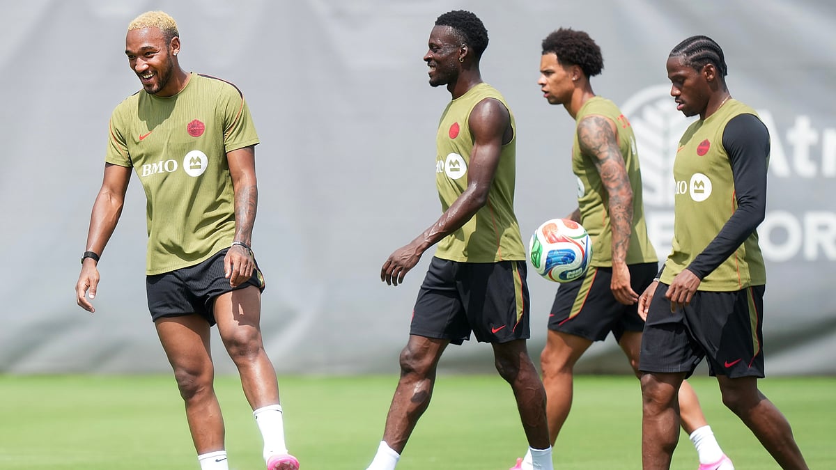 Canada defender Derek Cornelius, left, warms up during the selection camp for Canada’s national soccer team, Thursday, May 28, 2026, in Charlotte, N.C., ahead of the FIFA World Cup soccer tournament. - AP Photo