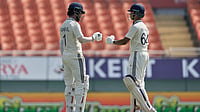 AP Photo/Ashwini Bhatia : India's KL Rahul, left, and batting partner Yashasvi Jaiswal touch gloves during the test match between Afghanistan and India in New Chandigarh, India on Saturday, June 6, 2026. 