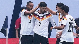 AP Photo : Germany forward Kai Havertz (7) celebrates with teammates after scoring a goal during the first half of an international friendly soccer match against United States in Chicago.
