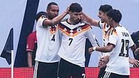 AP Photo : Germany forward Kai Havertz (7) celebrates with teammates after scoring a goal during the first half of an international friendly soccer match against United States in Chicago.
